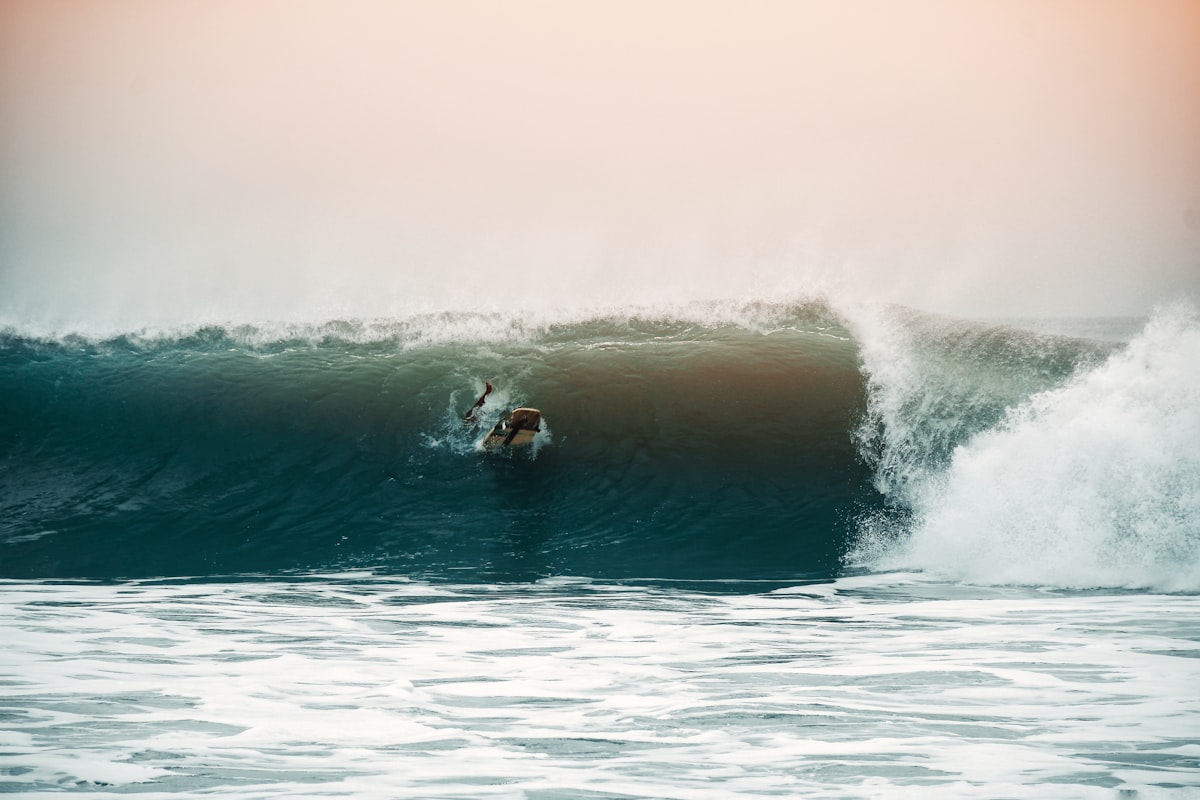 A surfer pulling into a clean barrel section